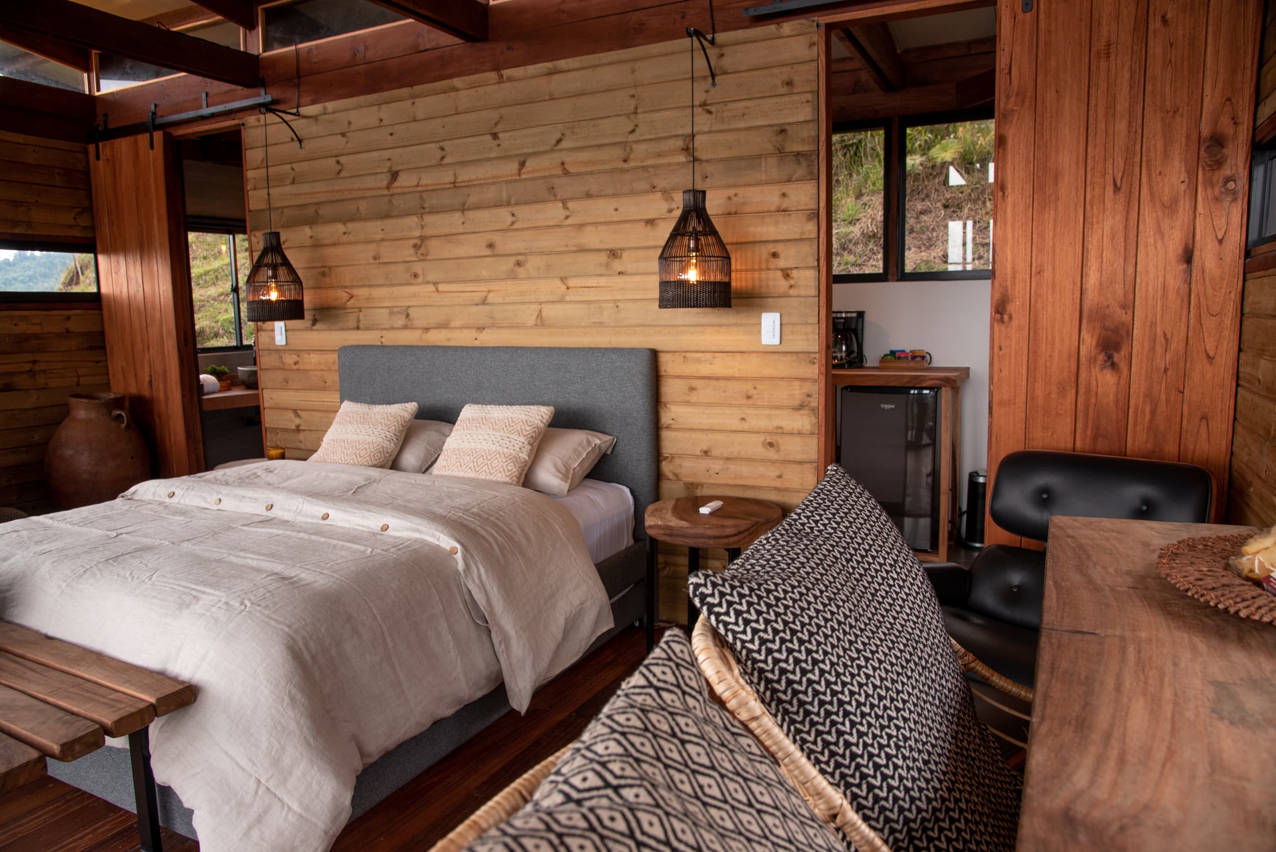 Cabin bedroom interior with pendant lights