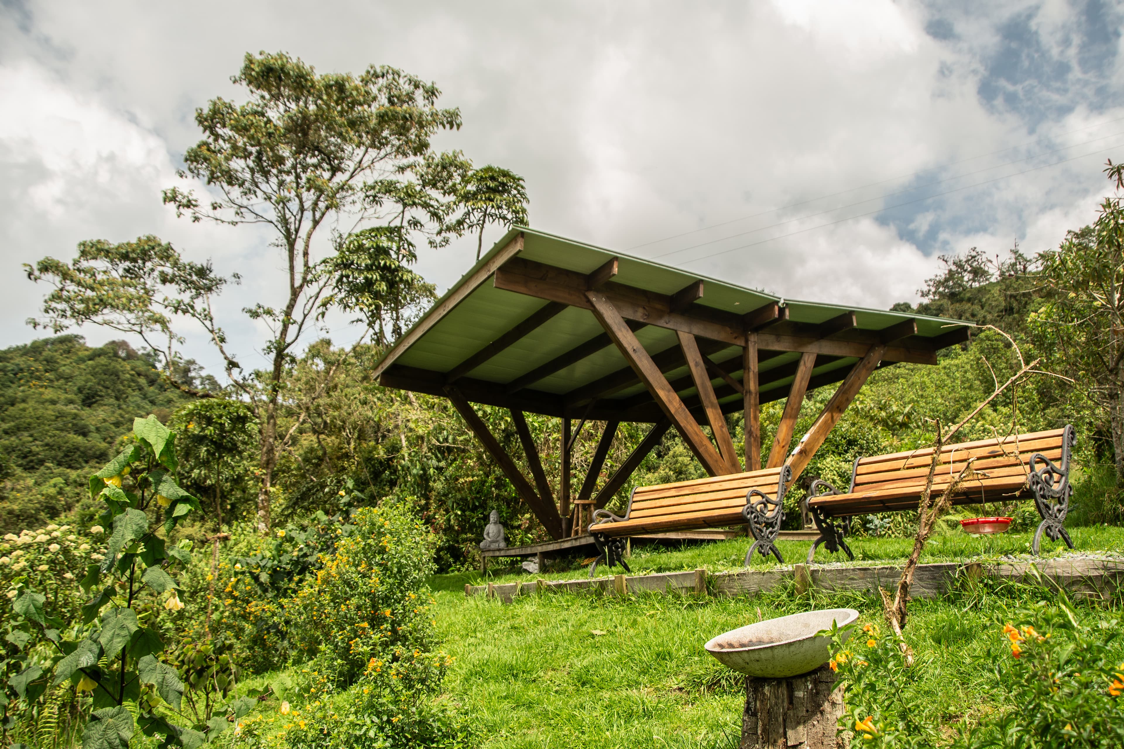 Birding shelter with Buddha statue and benches