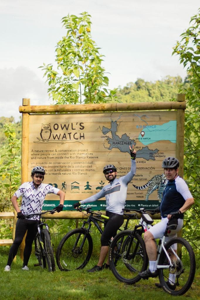 Cyclists at Owl's Watch sign
